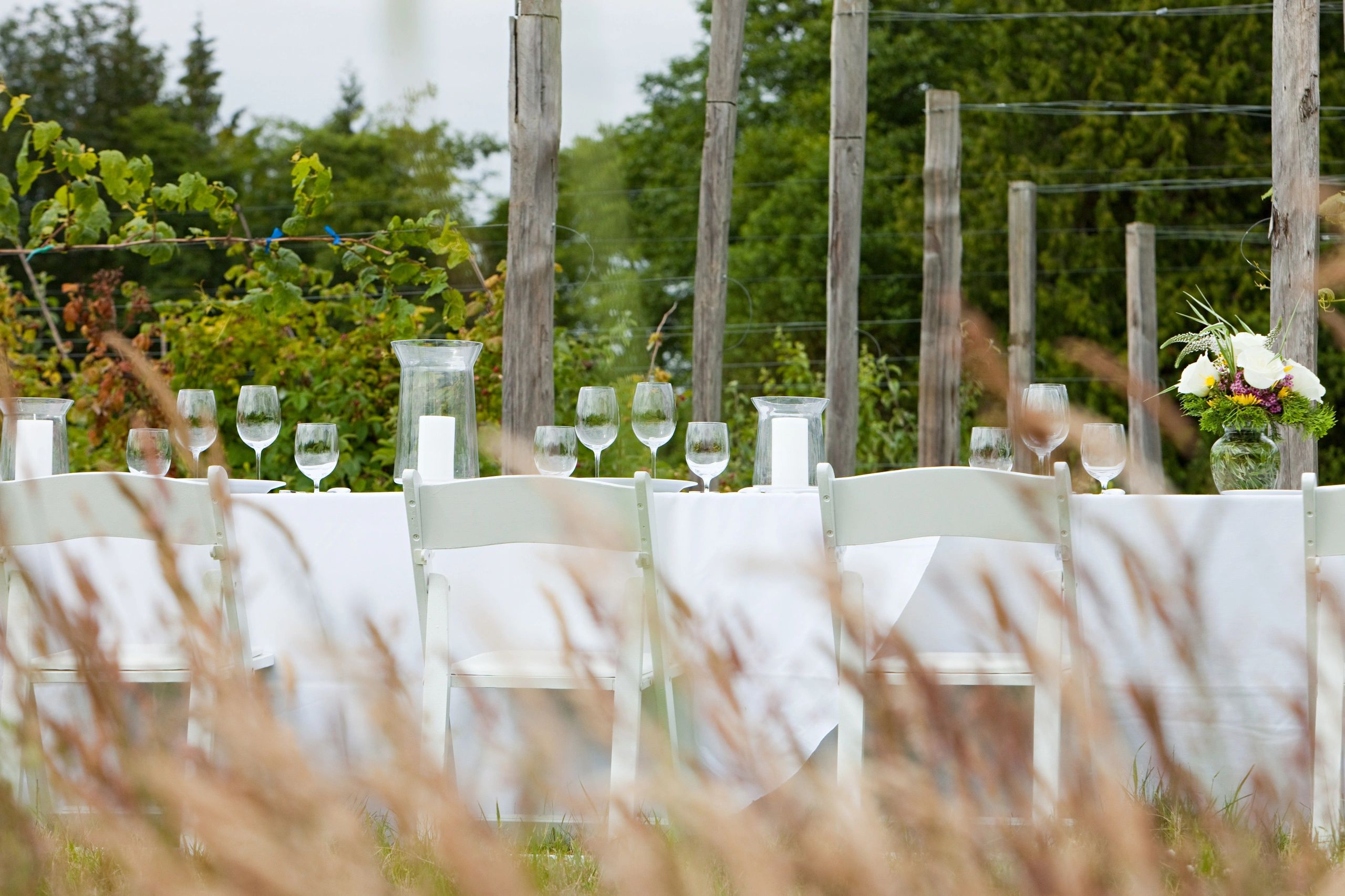 Styled event table setup for a private outdoor gathering