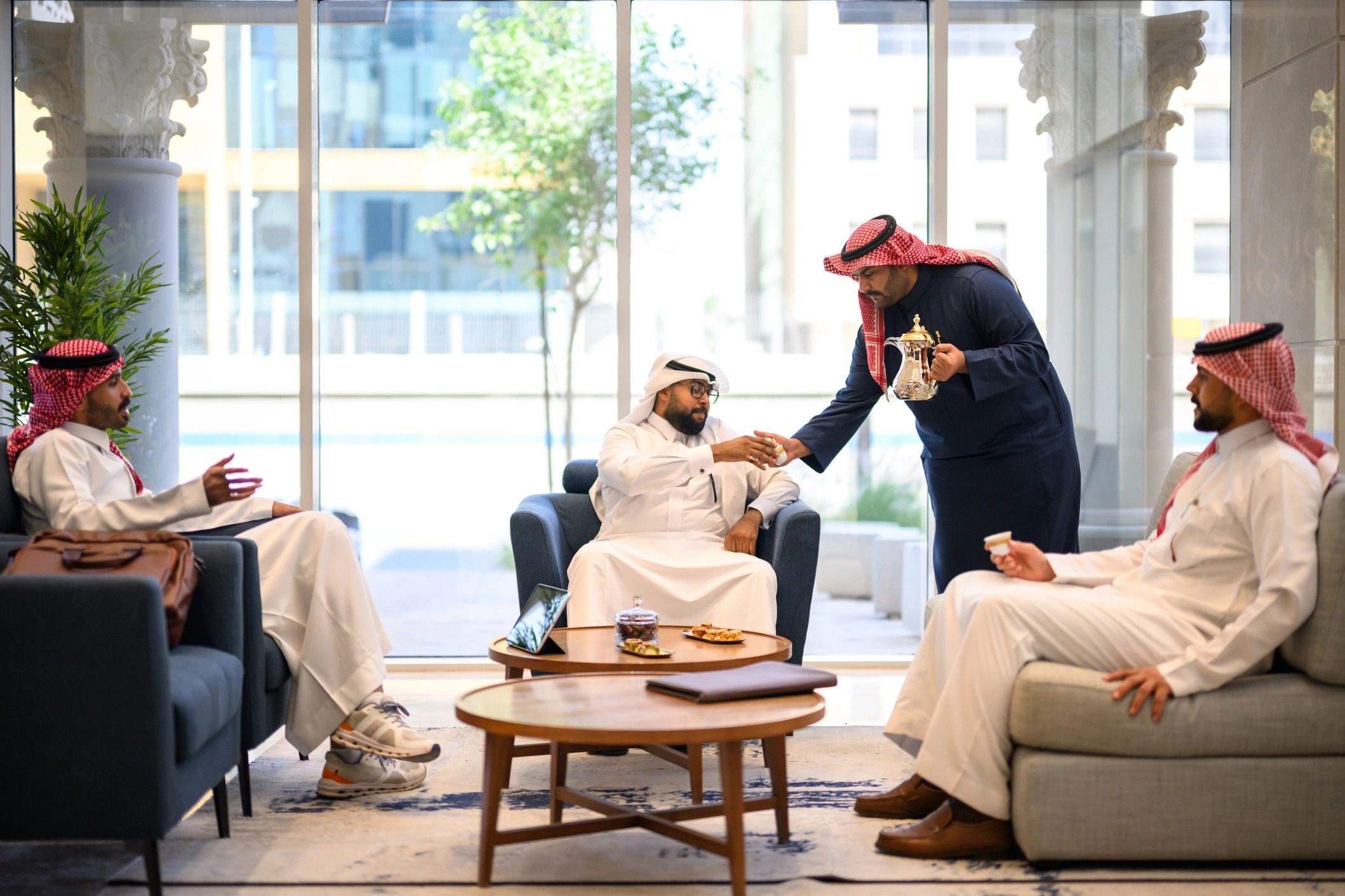 Arabic coffee service for seated guests in Riyadh event setting